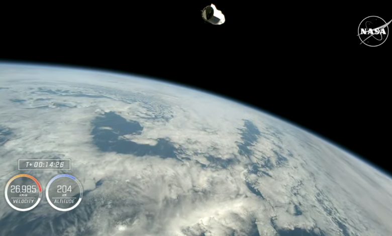 A screenshot of a live stream showing the Dragon capsule in orbit around Earth